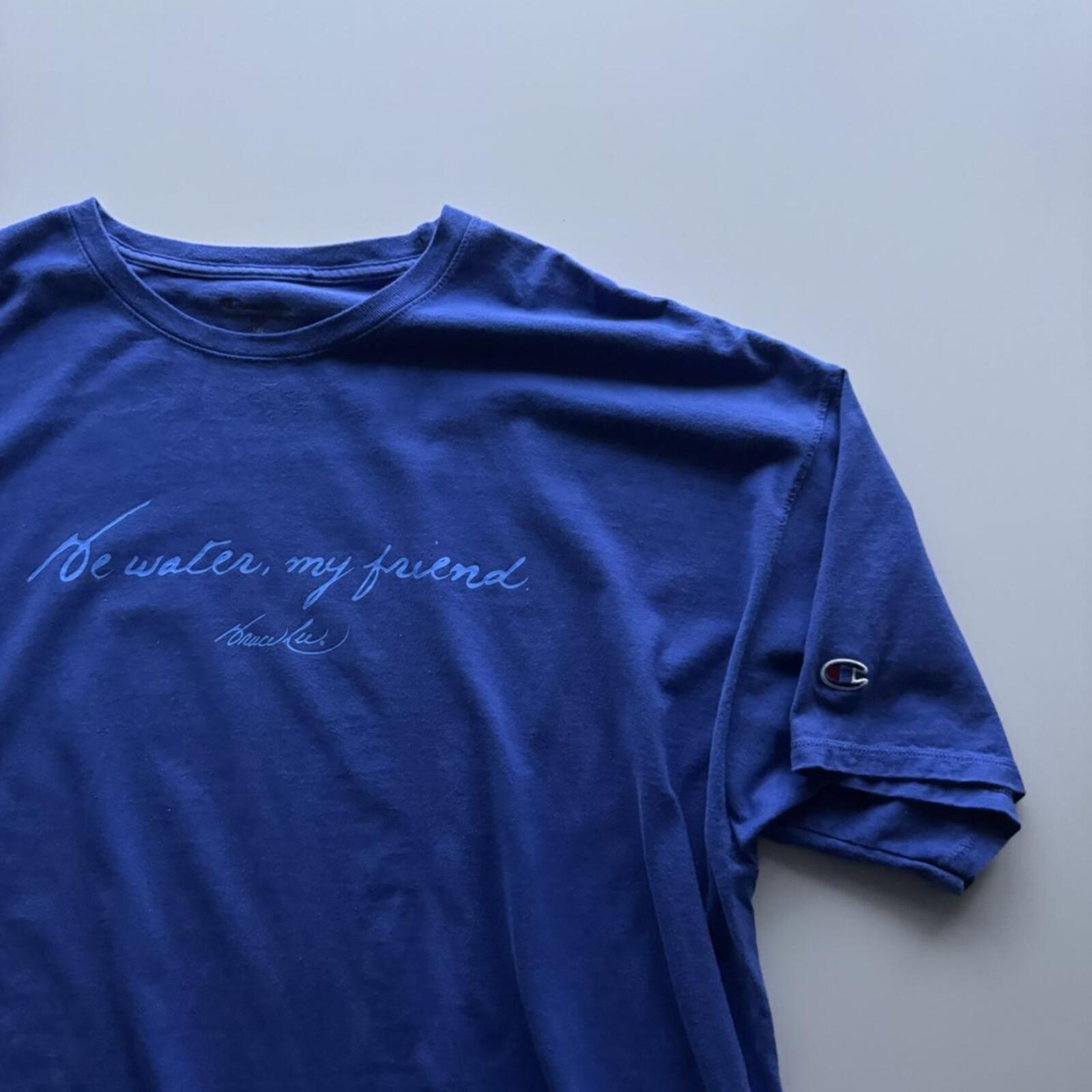 Champion “Be Water, My Friend” T-Shirt